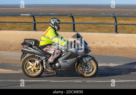 Honda VFR Southport, Merseyside UK Weather. 23rd November, 2020  Bright sunny cold day at the coast, as local residents enjoy the winter sunshine. Credit; MediaWorldImages/AlamyLiveNews Stock Photo