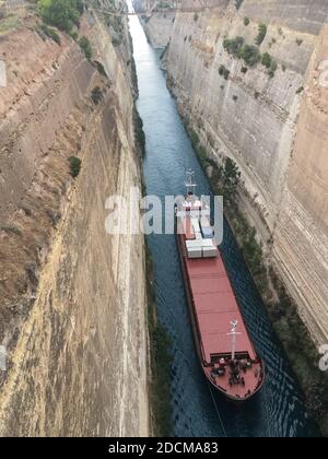 Korinth Greece. 24th July 2019. A cargo ship crosses the Corinth