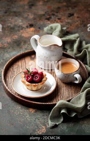 Tartlets with chocolate ganache and raspberries, selective focus Stock Photo