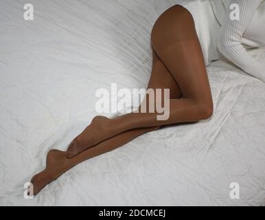 Legs covered from a pair of  pantyhose Stock Photo