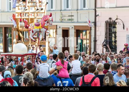 Lublin, Poland - July 27, 2014: Audience watching La Sbrindola show at new circus and busking festival Carnaval Sztukmistrzow Stock Photo