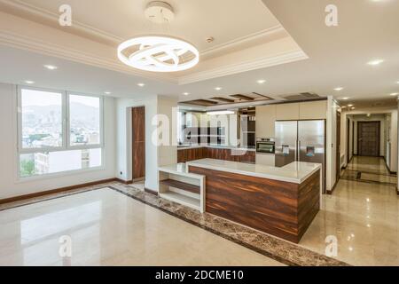 View of the kitchen and living room empty of appliances Stock Photo
