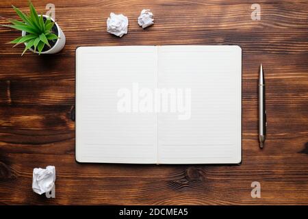 Diary open on a wooden table copy space. Stock Photo