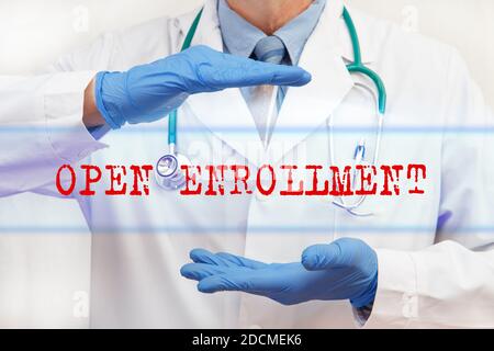 Doctor's hands with OPEN ENROLLMENT inscription. Medical concept Stock Photo
