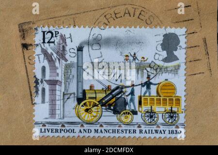 British vintage cancelled postage stamp showing Stephenson's Rocket from 1980. On paper with full postmark saying worlds greatest hobby. Stock Photo