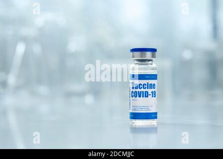 Covid 19 corona virus vaccine vial bottle for injections on medical background. Stock Photo