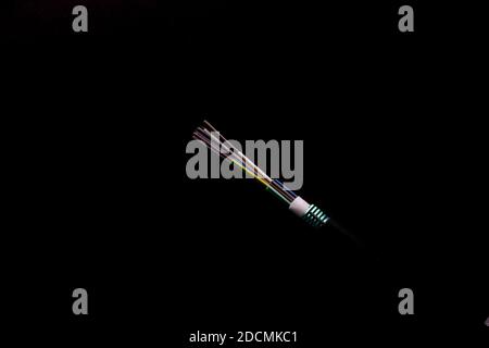 A closeup shot of fiber optic cable isolated on black background Stock Photo