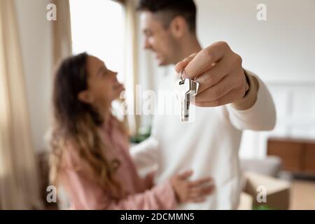 Young couple showing keys to the new house close up Stock Photo
