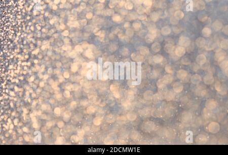 Christmas glittering Golden Background. Christmas lights. Blurred Xmas Bokeh as a Greeting card Stock Photo