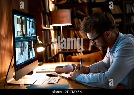 Business man video conference calling on computer working from home office. Stock Photo