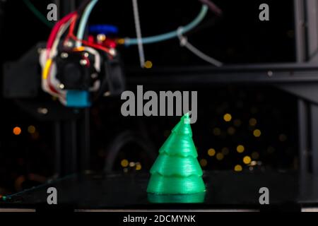 green Christmas tree printed on 3D printer. technology. Stock Photo