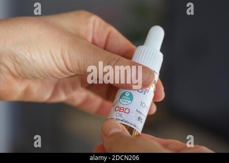 Woman using CBD oil Stock Photo