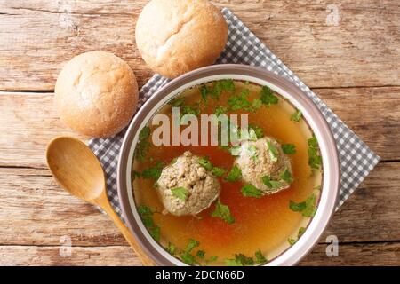 Homemade German broth with liver dumplings close-up in a plate on the table. horizontal top view from above Stock Photo
