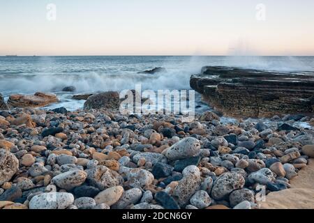 Long exposure images of North Sea waves  crashing in over rocks at Trow Beach, South Sheilds, Tyne and Wear. Stock Photo