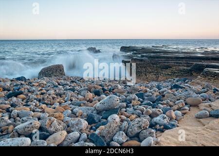 Long exposure images of North Sea waves  crashing in over rocks at Trow Beach, South Sheilds, Tyne and Wear. Stock Photo