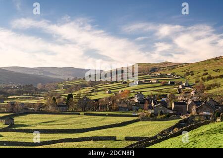 A HDR of Gunnerside and surrounding pasture in winter sunshine. Swaledale, Yorkshire Dales National Park, Yorkshire England. 19 November 2020 Stock Photo