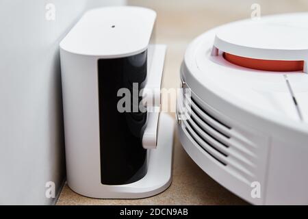 Robot vacuum cleaner return to the charge after cleaning room Modern smart household Stock Photo