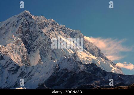 The snow-capped mountain peak in the Himalayas is visible from an airplane. Stock Photo