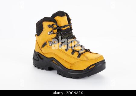 yellow hiking boots on white background Stock Photo
