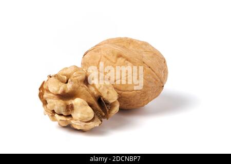 Walnut without nutshell and nutshell walnut isolated on white Stock Photo