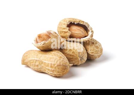 Raw peanuts isolated on white. Heap of groundnuts in a nutshell Stock Photo