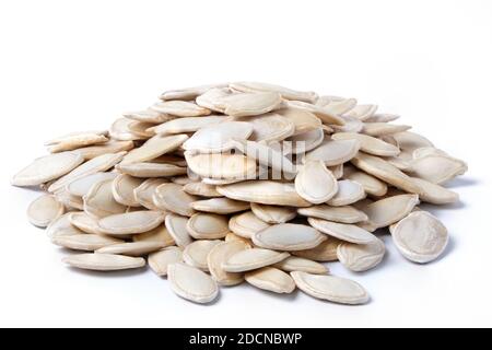 Raw dried pumpkin seeds isolated on white. Heap of pumpkin seeds Stock Photo