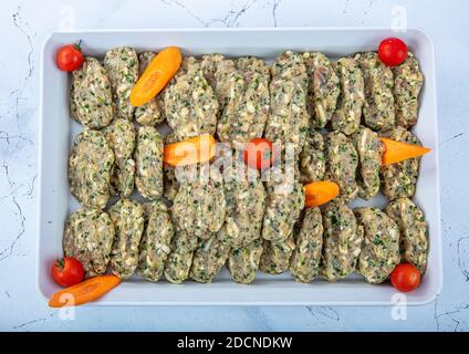 Turkish cuisine appetizers; Traditional Turkish and Greek, fish balls appetizer. Fish Meatballs Frying in Pan / Kofte or Kofta. Stock Photo