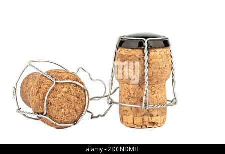 Two corks of champagne with muselet isolated on white background. Copy space. Close up. Stock Photo