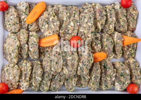 Turkish cuisine appetizers; Traditional Turkish and Greek, fish balls appetizer. Fish Meatballs Frying in Pan / Kofte or Kofta. Stock Photo