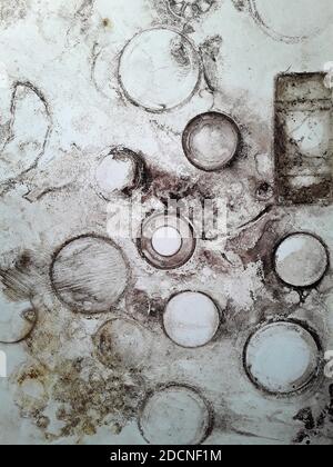 Round flowerpot stains on white background. Round mud stains. Flower pot stains. Soil stain rings. Stock Photo