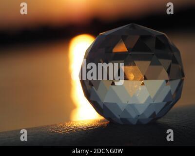 Glass object in lake  sunset Stock Photo