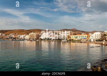 Tinos / Greece - October 17 2020: Afternoon view of the waterfront of Tinos, in the autumn.  Tinos is a Greek island situated in the Aegean Sea. Stock Photo