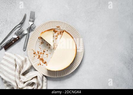 Tasty Plain New York Style Cheesecake On Concrete Background, Top View Stock Photo