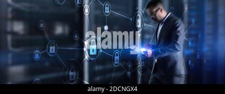 Security data protection concept. Businessman protecting data personal information on tablet and virtual interface. Stock Photo