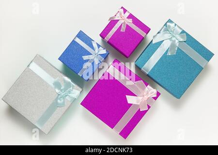 Set of many blue, purple, silver New Year's gift boxes with ribbons and bows on a white background. Festive concept, Christmas, Valentine's Day, Birth Stock Photo