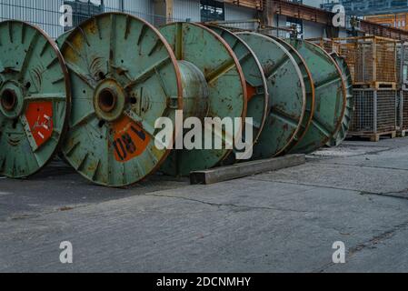 Lots of empty cable drums, an old cable factory, empty cable drums, industrial ambience Stock Photo