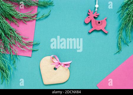 christmas layout with ornaments and heart shaped gingerbread in green and pink Stock Photo