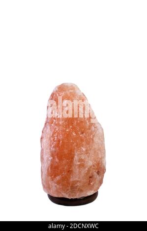 Himalayan Salt Lamp on white background in vertical. Stock Photo
