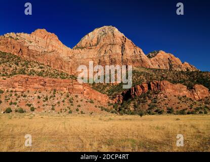 View To A Colorful Mountain At Zion National Park In The Late Afternoon Sun On A Sunny Summer Day With A Clear Blue Sky Stock Photo