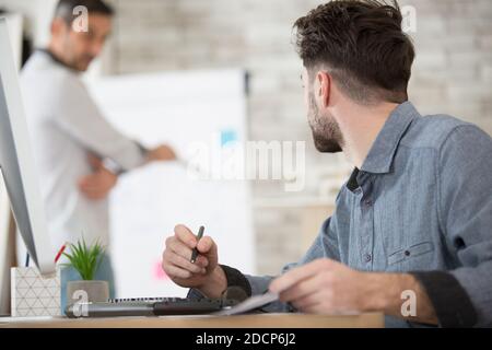 portrait of two architects looking at project scheme Stock Photo