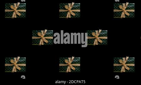 christmas pattern green gift boxes on black background Stock Photo