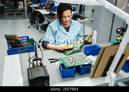 freshly made computer boards in a plastic box Stock Photo
