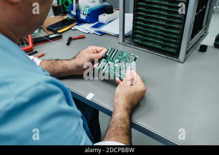 person with plate in hands and plate holder Stock Photo