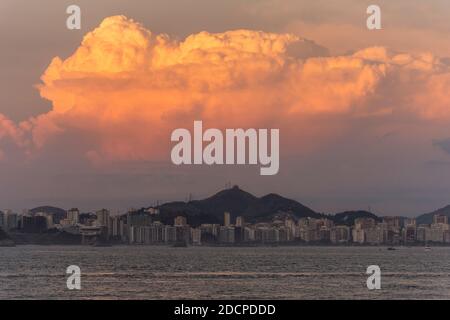 Beautiful ocean sunset view to Niterói and orange clouds, Rio de Janeiro, Brazil Stock Photo