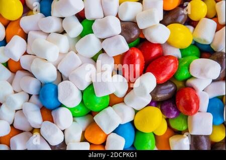 Mix of colorful Candies, delights and marshmallow on the plate. The sugar feast, any celebrations or children's party. Stock Photo