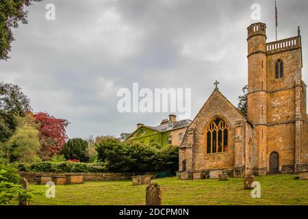 The old parish graveyard alongside the St Michael & All Angles Church in historic East Coker, England, UK Stock Photo