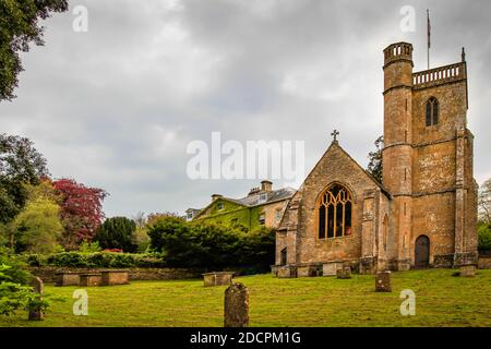 The old parish graveyard alongside the St Michael & All Angles Church in historic East Coker, England, UK Stock Photo