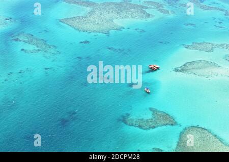 Cloud 9, a floating platform on the Roro reef near Malolo Island in Fiji. Crystal clear blue and turquoise waters with coral reefs surround the resort. Stock Photo