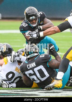 Jacksonville, FL, USA. 22nd Nov, 2020. Pittsburgh Steelers wide receiver  Diontae Johnson (18) attempts to avoid Jacksonville Jaguars free safety  Jarrod Wilson (26) during 2nd half NFL football game between the Pittsburgh