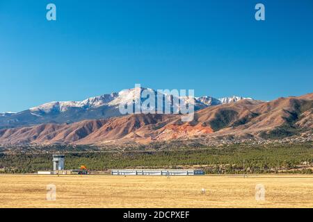 Panoramic view of Pikes Peak with air traffic control tower and rock formations. Colorado Springs, Colorado Stock Photo